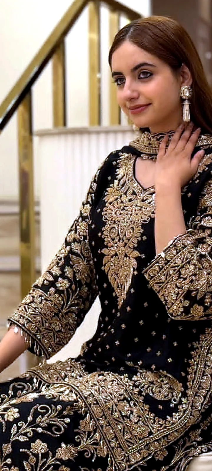 Black and gold formal dress neckline and sleeve embroidery detail