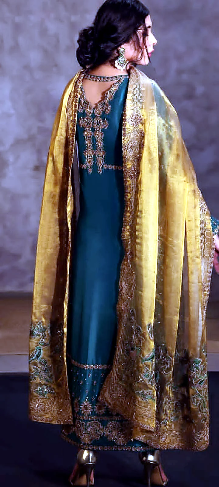 Emerald green formal dress back view with gold dupatta